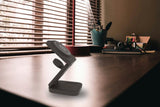 Black – on a desk by the window
